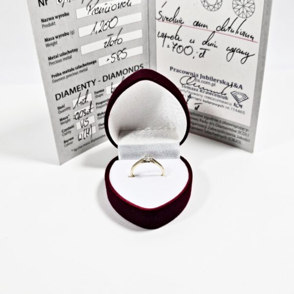 Złoty pierścionek z brylantem certyfikat pr585/14K 1.2g R10